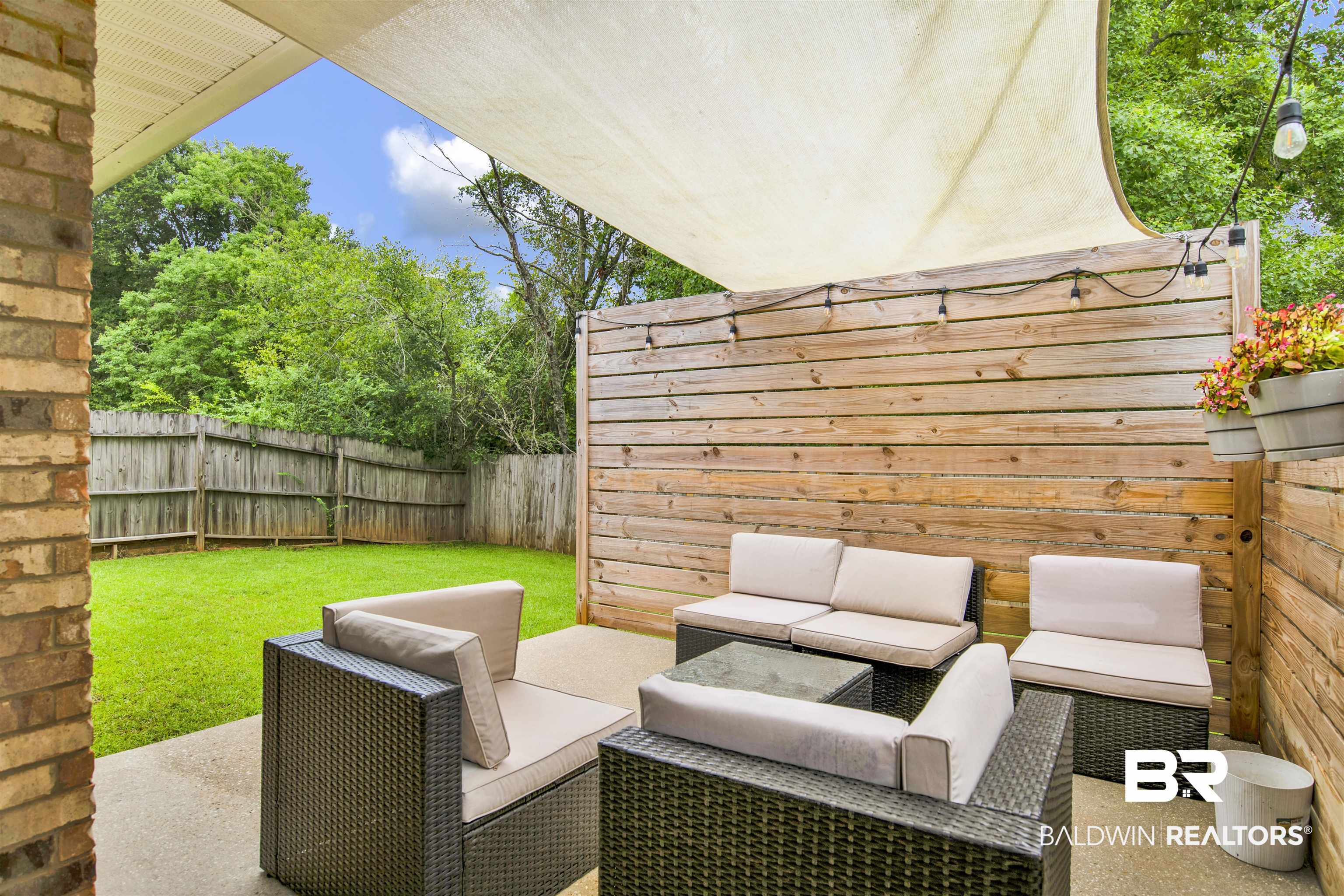 4012 Kendallbrook Loop Foley, AL 36535 - Photo 26 of 31 Fenced backyard featuring an outdoor hangout area and a patio