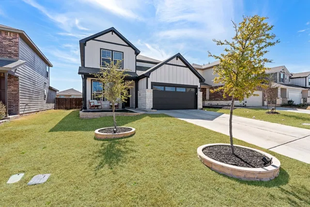 a swimming pool with a yard in front of it