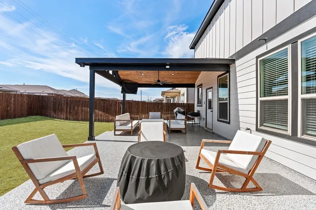 a view of an outdoor sitting area with furniture