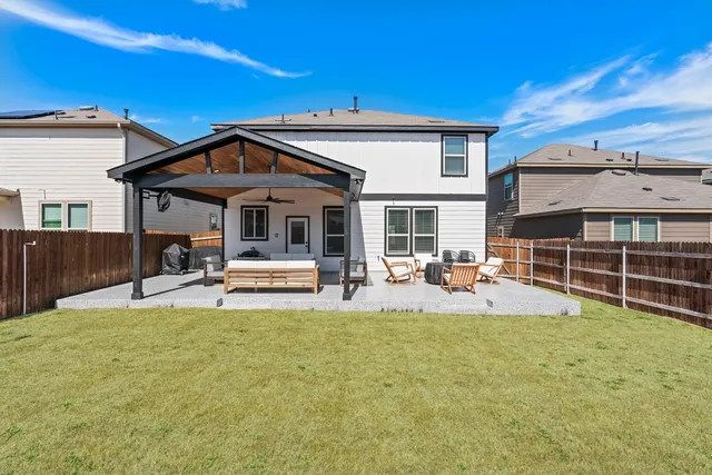 a view of a house with sitting area and view of a house