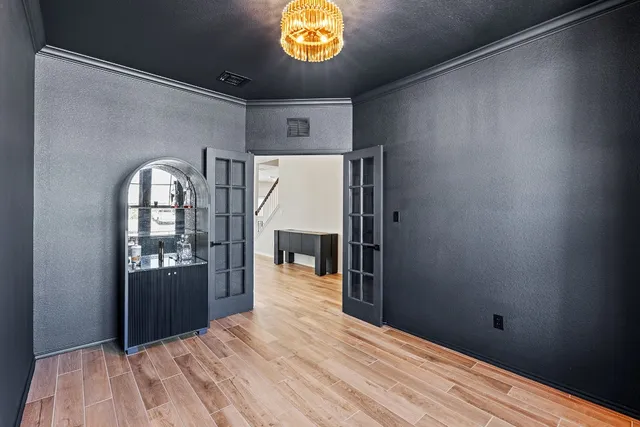 a view of entryway with stairs and wooden floor