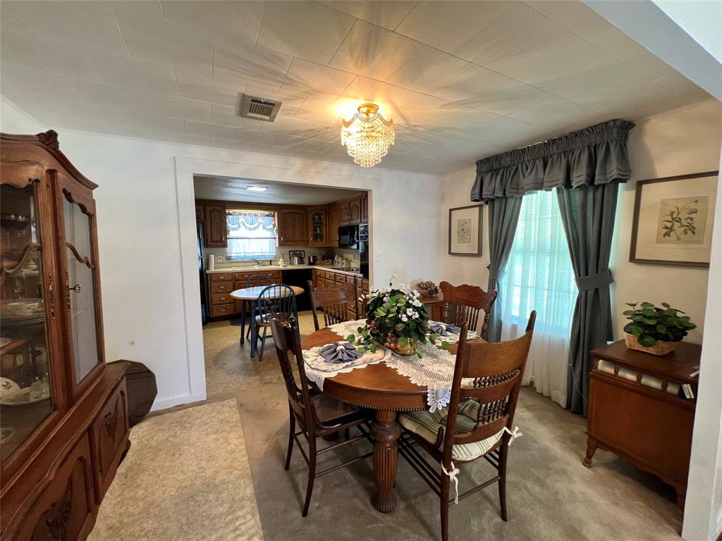 104 East Little Street Hamilton, TX 76531 - Photo 7 of 27 a dining room with furniture and window