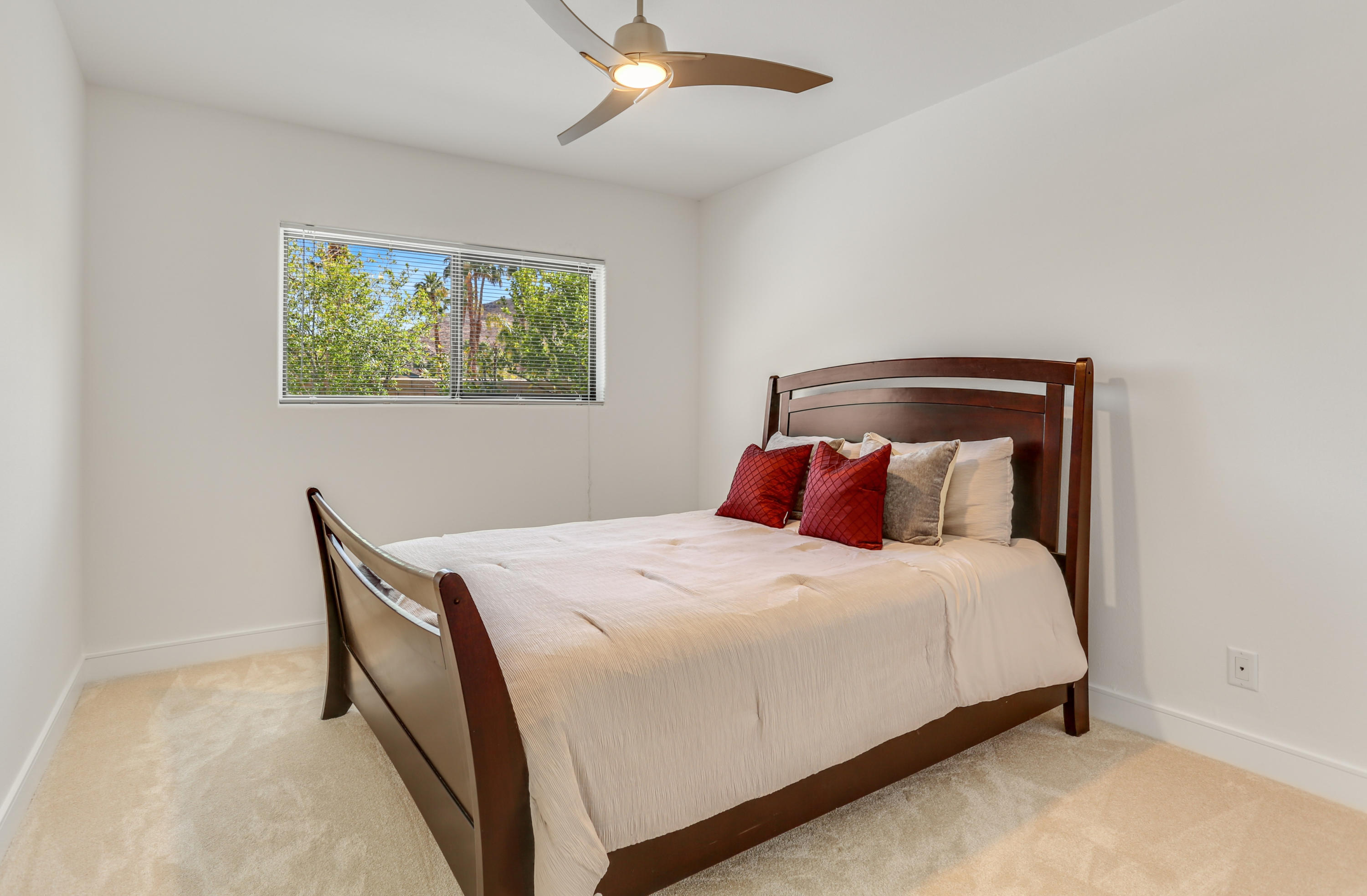 71480 Halgar Road Rancho Mirage, CA 92270 - Photo 20 of 52 a bedroom with a bed and a painting on the wall