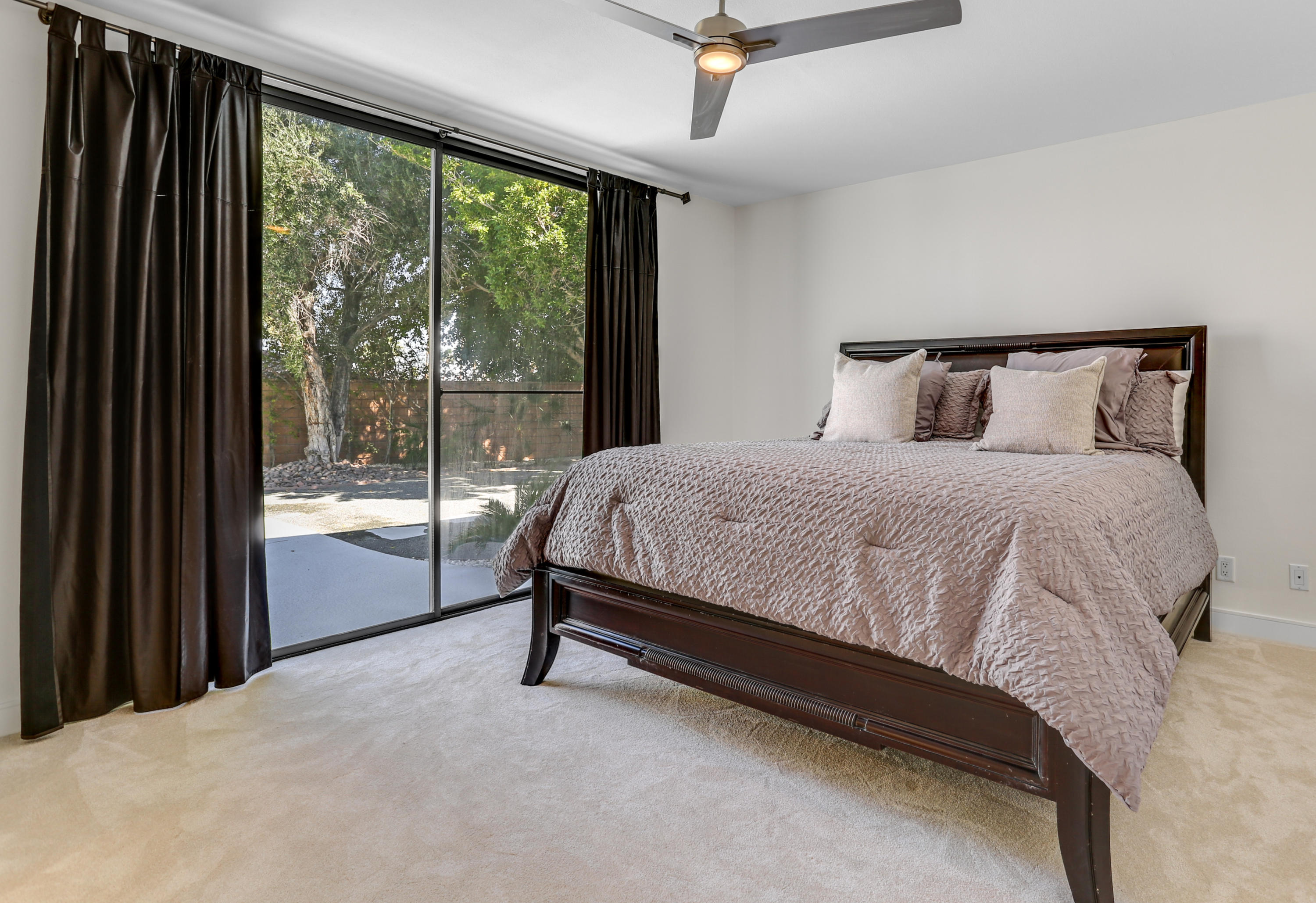 71480 Halgar Road Rancho Mirage, CA 92270 - Photo 22 of 52 a bedroom with a bed and large window