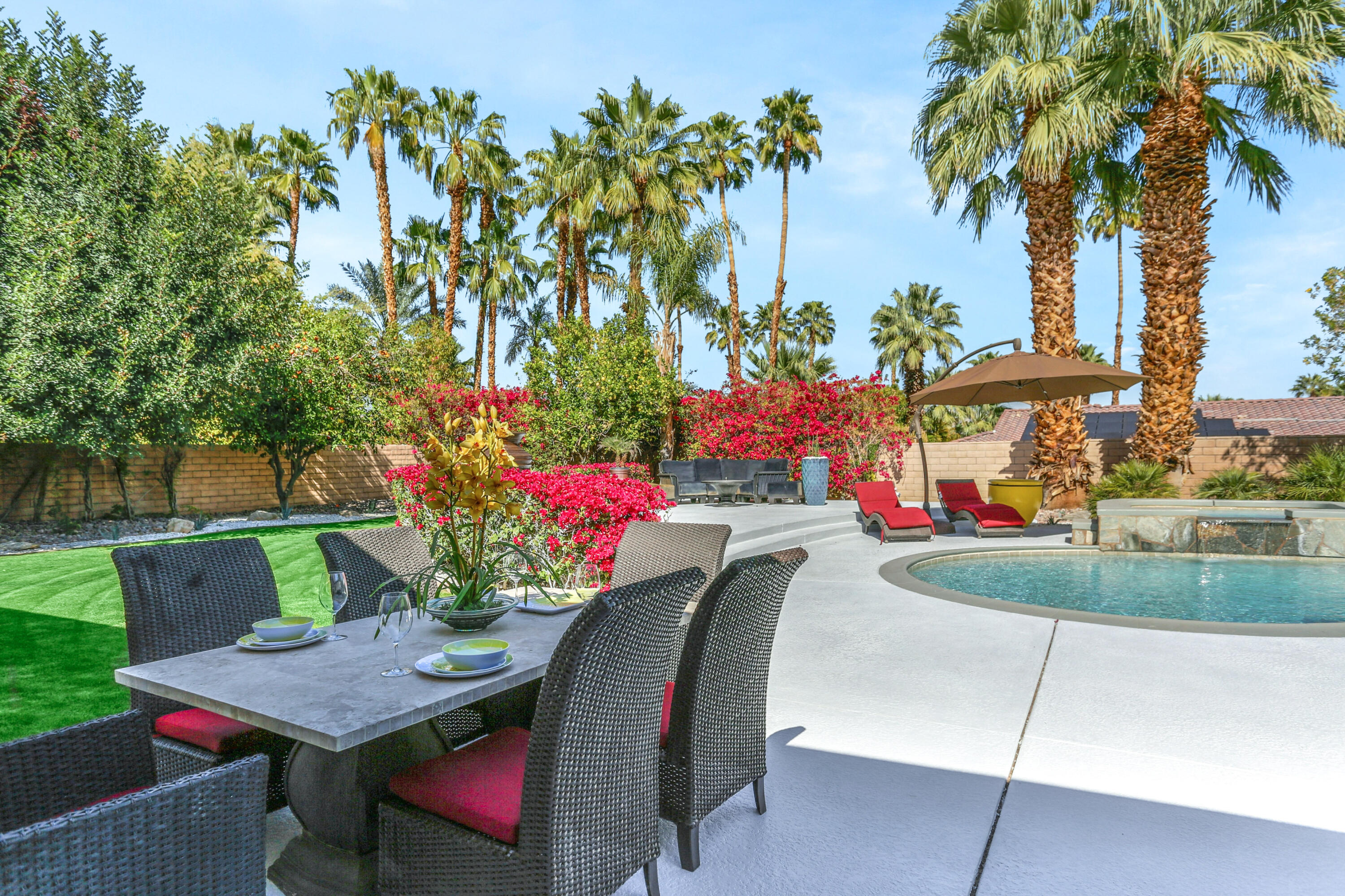 71480 Halgar Road Rancho Mirage, CA 92270 - Photo 26 of 52 a view of a table and chairs in a patio