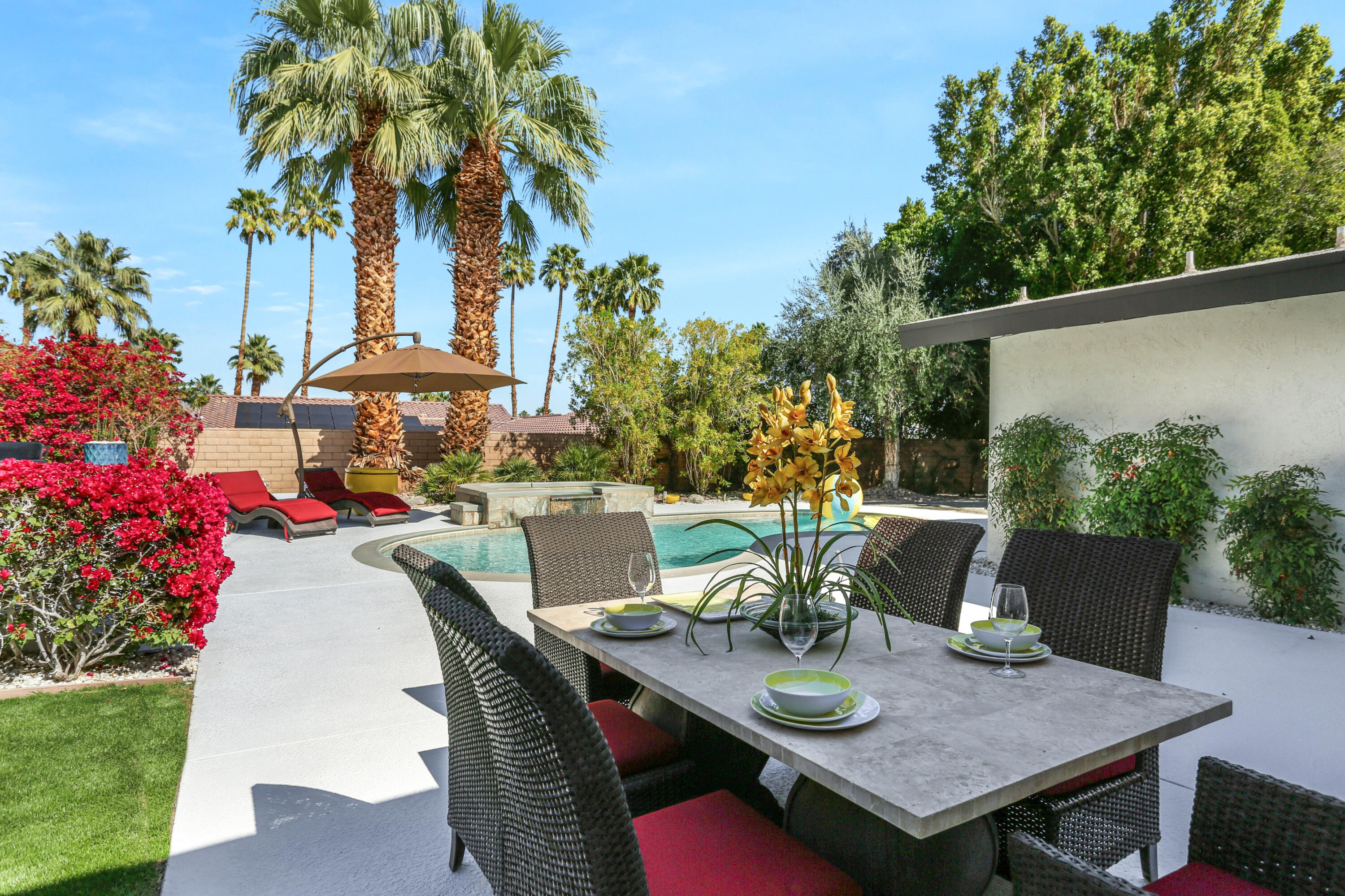 71480 Halgar Road Rancho Mirage, CA 92270 - Photo 27 of 52 a view of a dining table and chairs in the patio