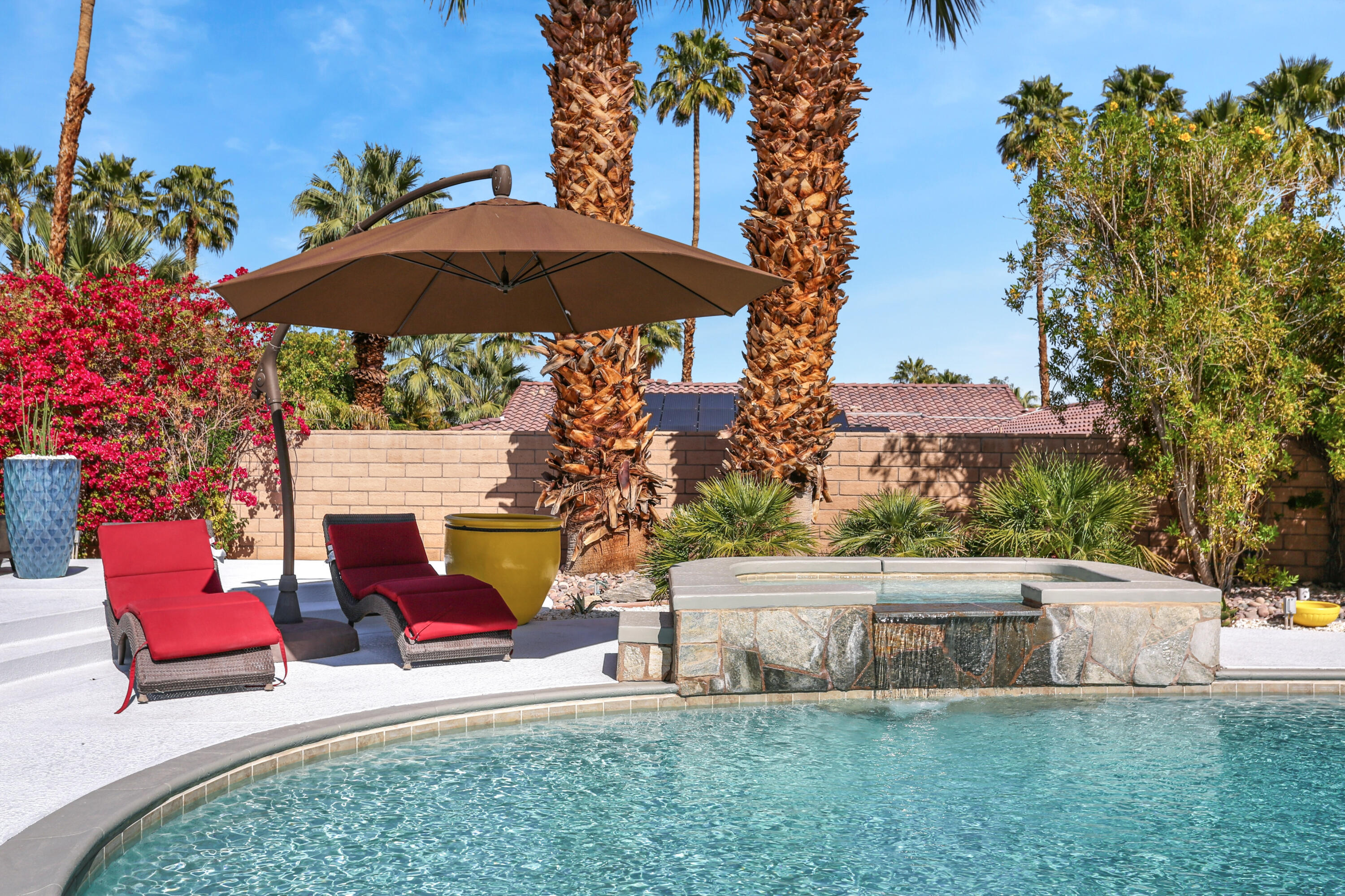 71480 Halgar Road Rancho Mirage, CA 92270 - Photo 28 of 52 an outdoor space with furniture and umbrella