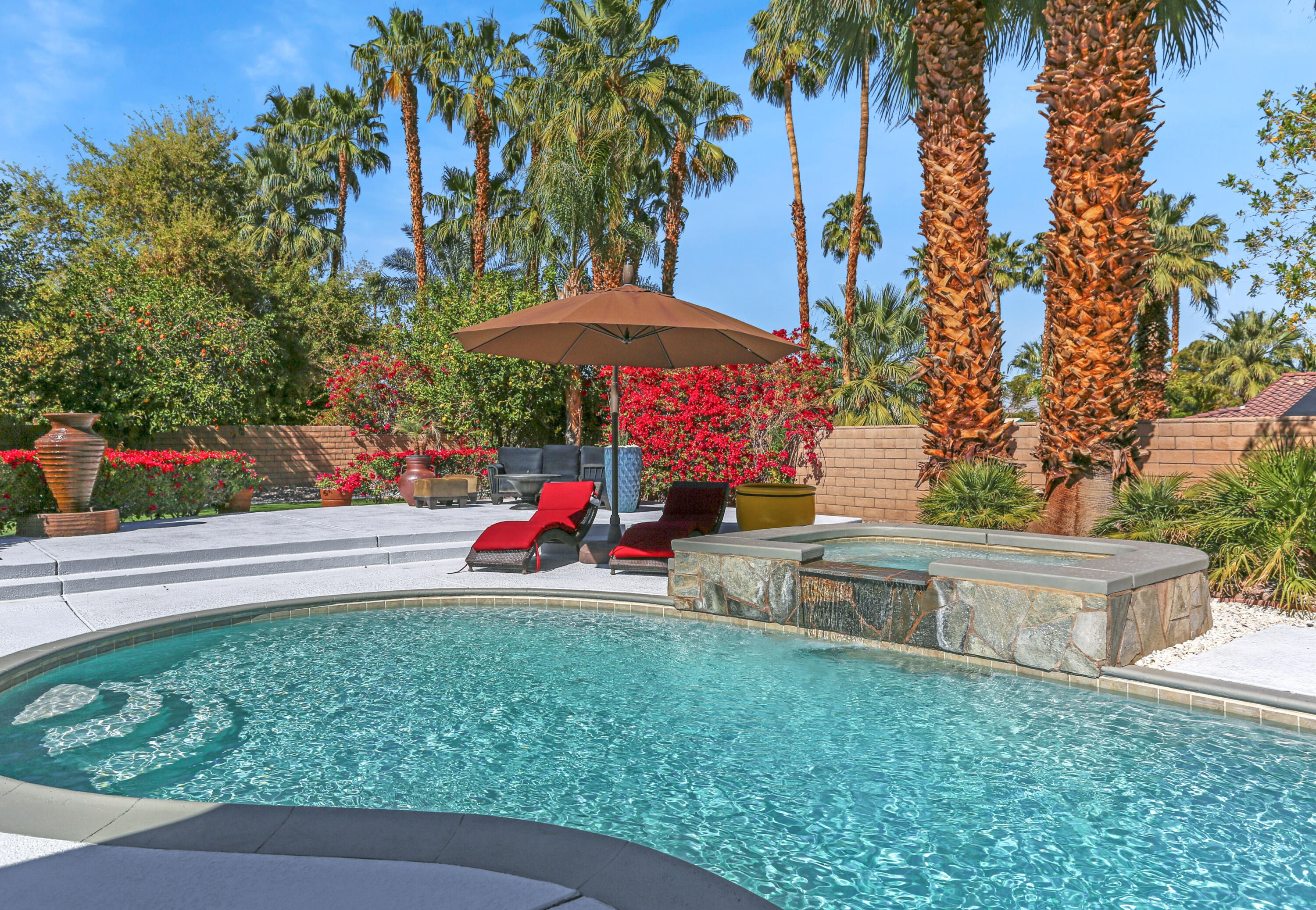 71480 Halgar Road Rancho Mirage, CA 92270 - Photo 29 of 52 a view of backyard with outdoor seating and trees