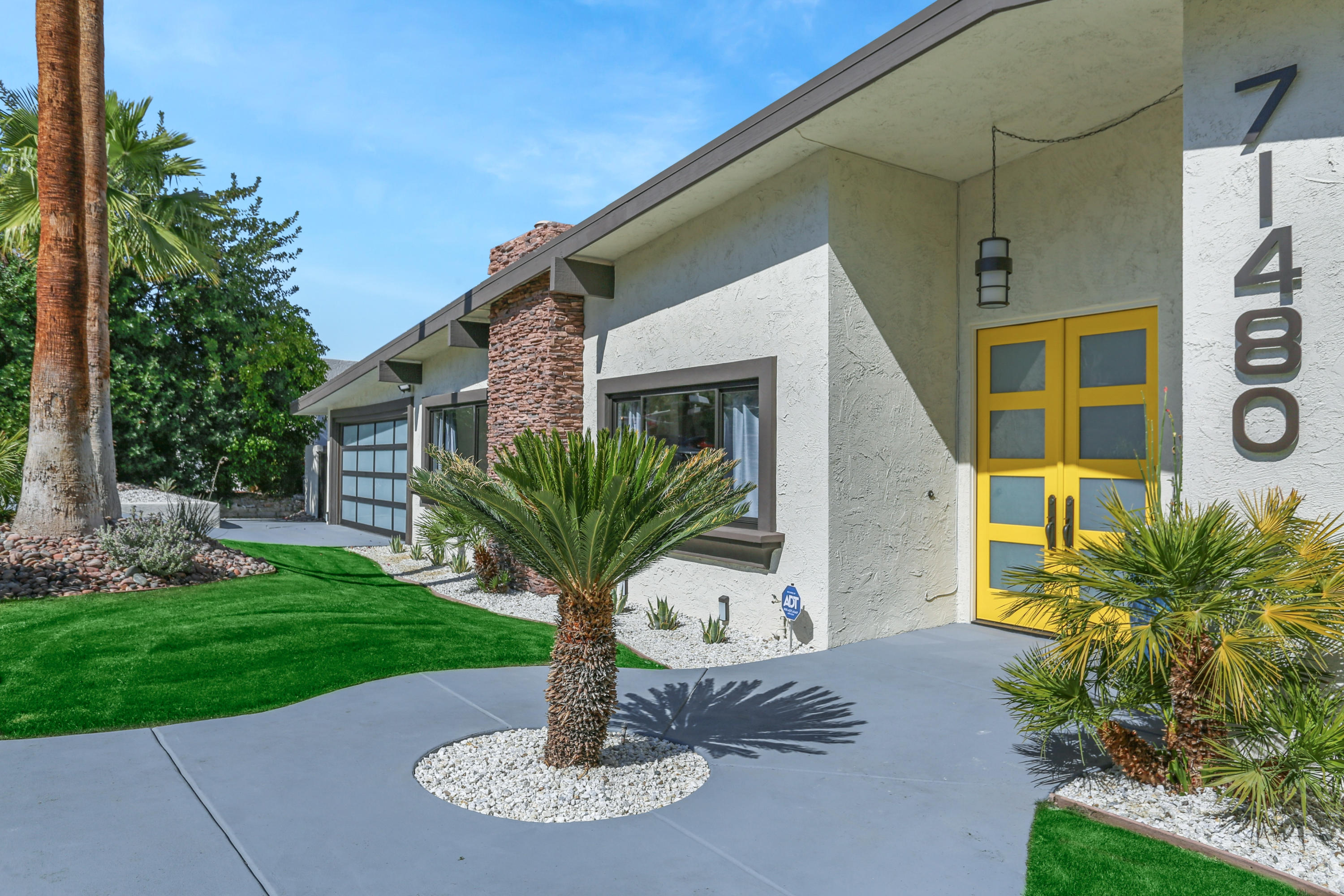 71480 Halgar Road Rancho Mirage, CA 92270 - Photo 4 of 52 a house with garden in front of it