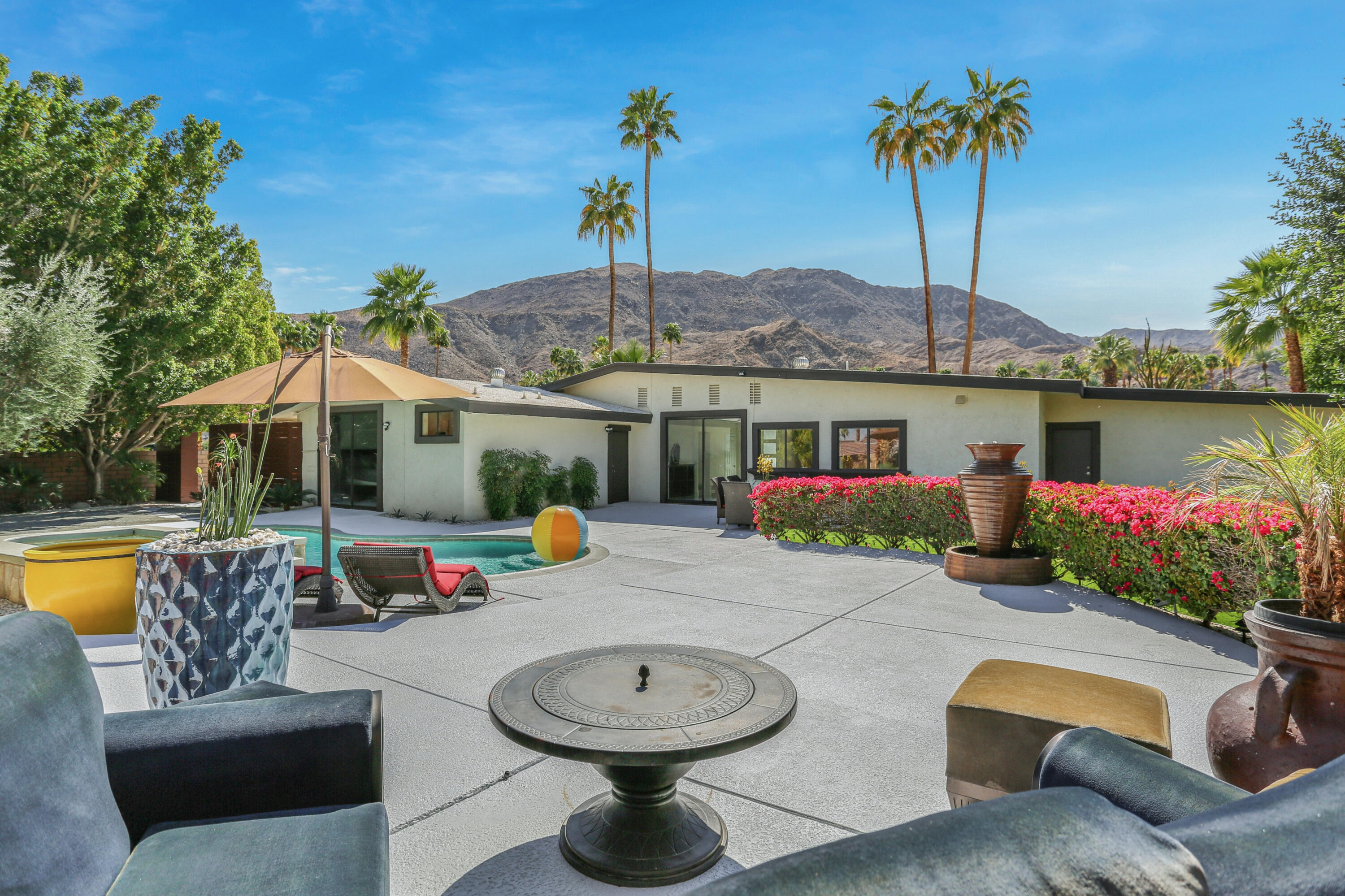 71480 Halgar Road Rancho Mirage, CA 92270 - Photo 32 of 52 a view of a patio with swimming pool table and chairs