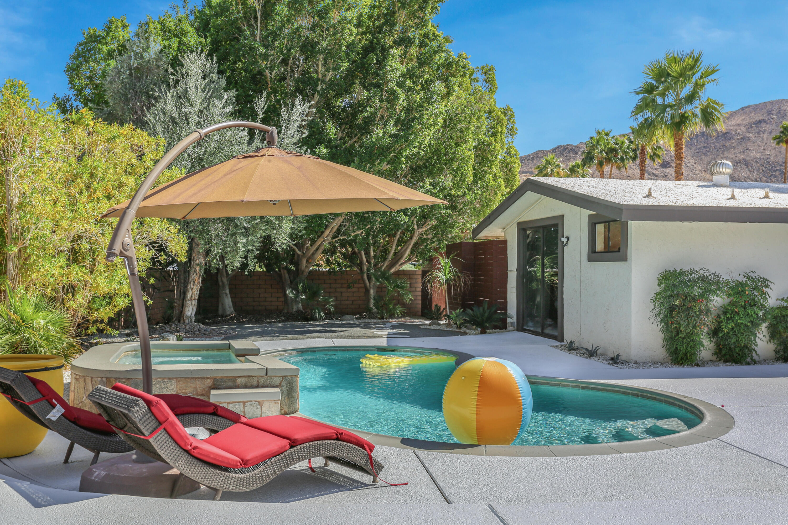 71480 Halgar Road Rancho Mirage, CA 92270 - Photo 35 of 52 a view of backyard with swimming pool and outdoor seating