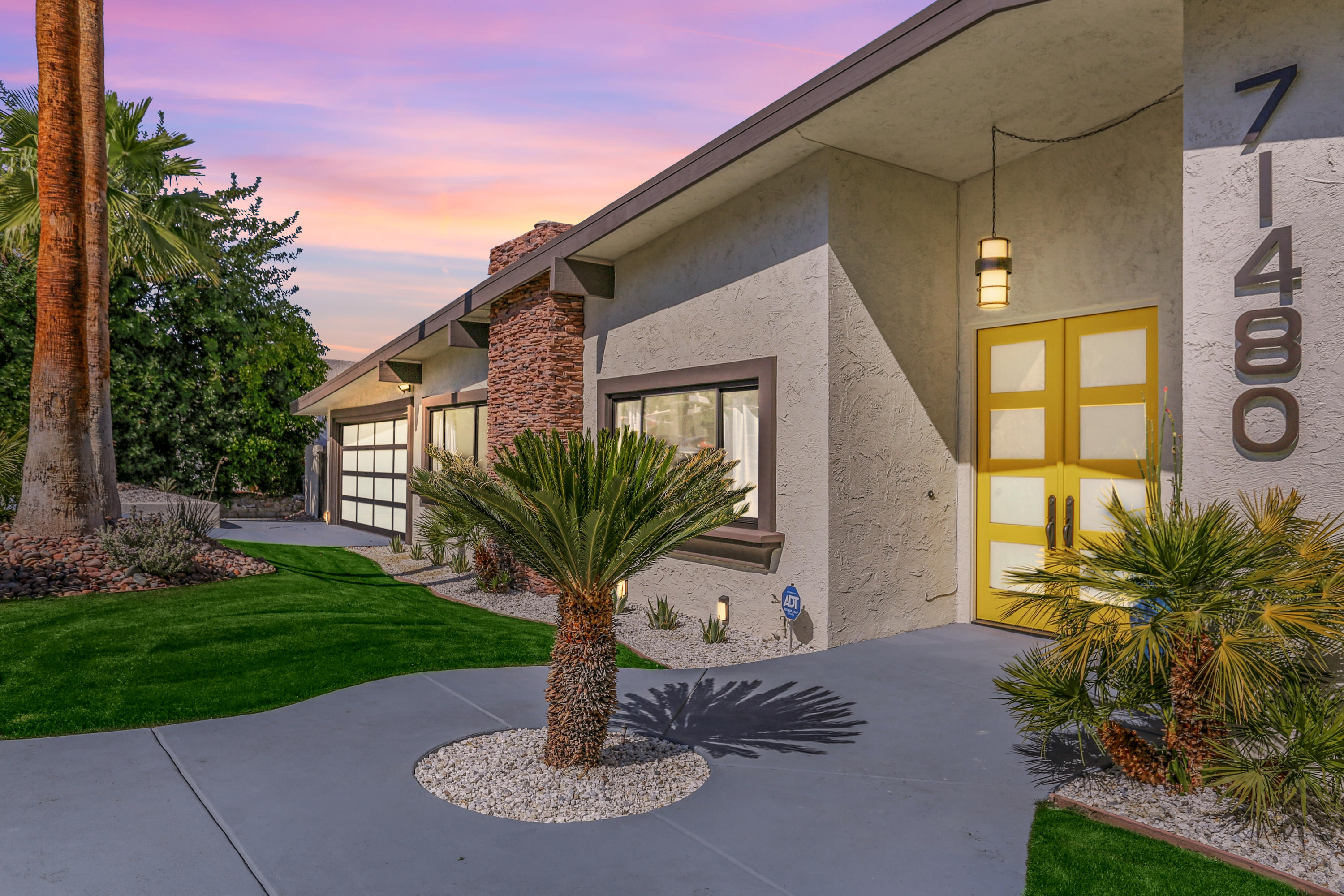 71480 Halgar Road Rancho Mirage, CA 92270 - Photo 44 of 52 a house with garden in front of it