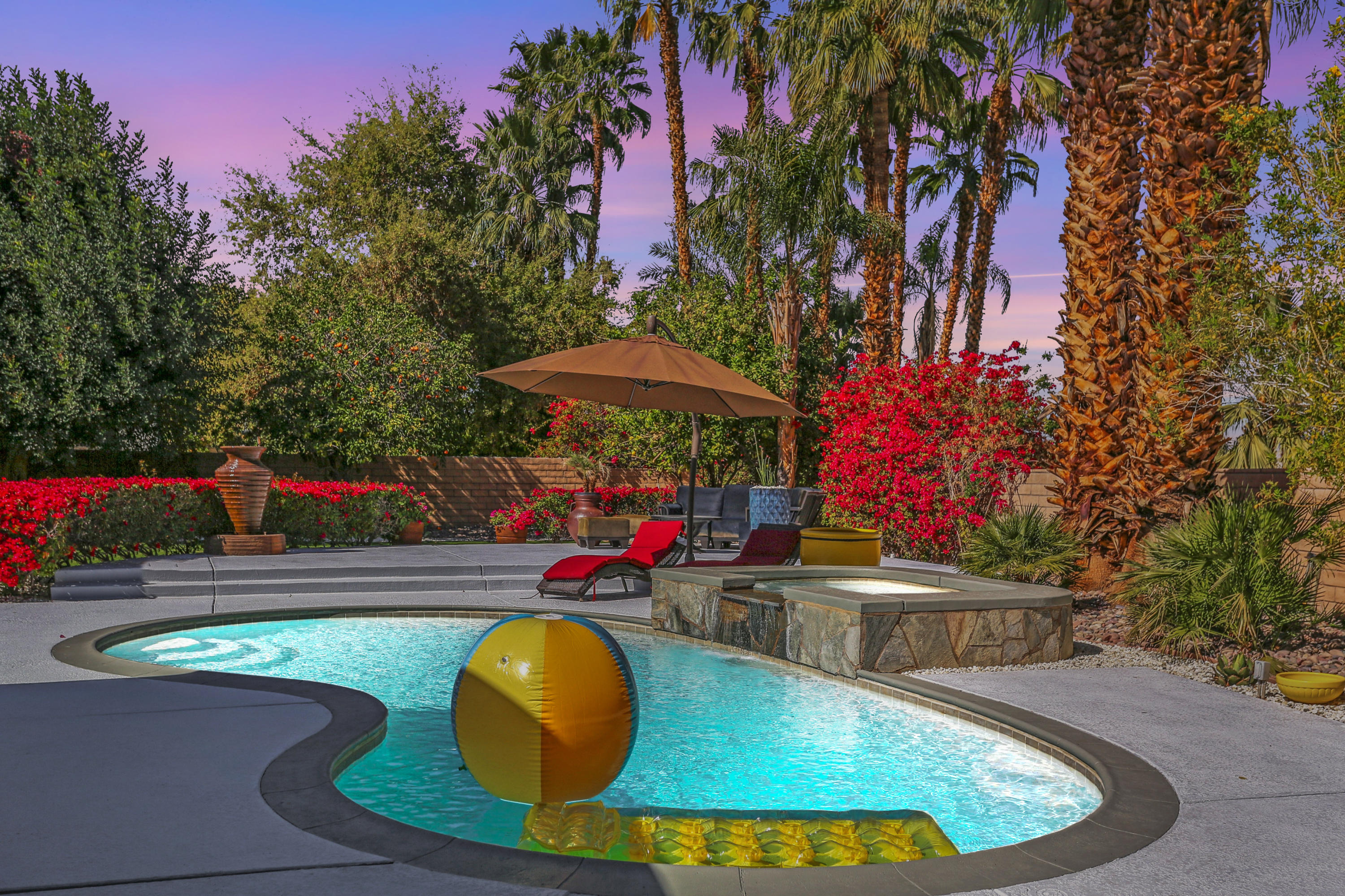 71480 Halgar Road Rancho Mirage, CA 92270 - Photo 47 of 52 an outdoor sitting area with an umbrella