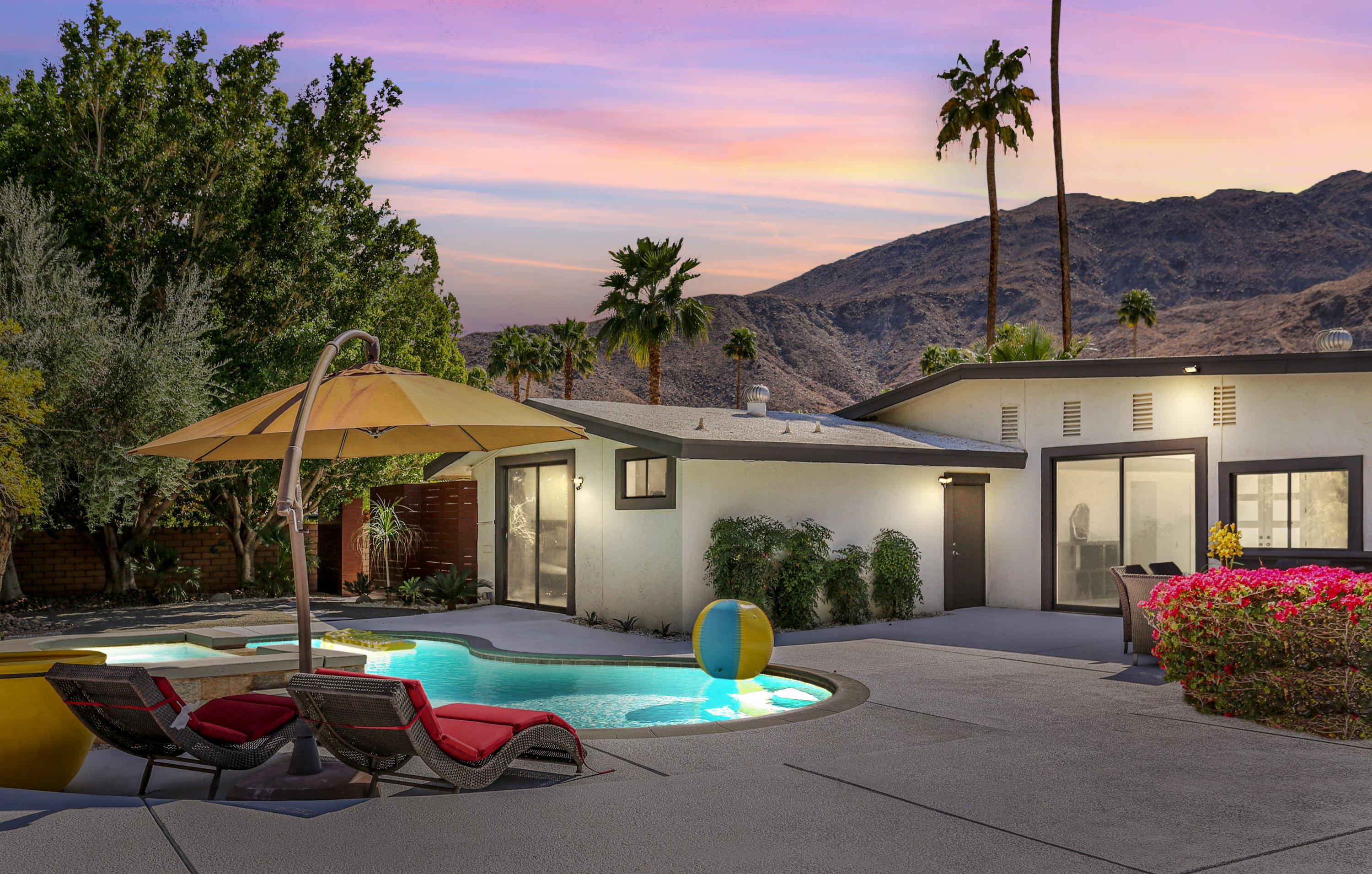 71480 Halgar Road Rancho Mirage, CA 92270 - Photo 49 of 52 a patio with a table and chairs under an umbrella