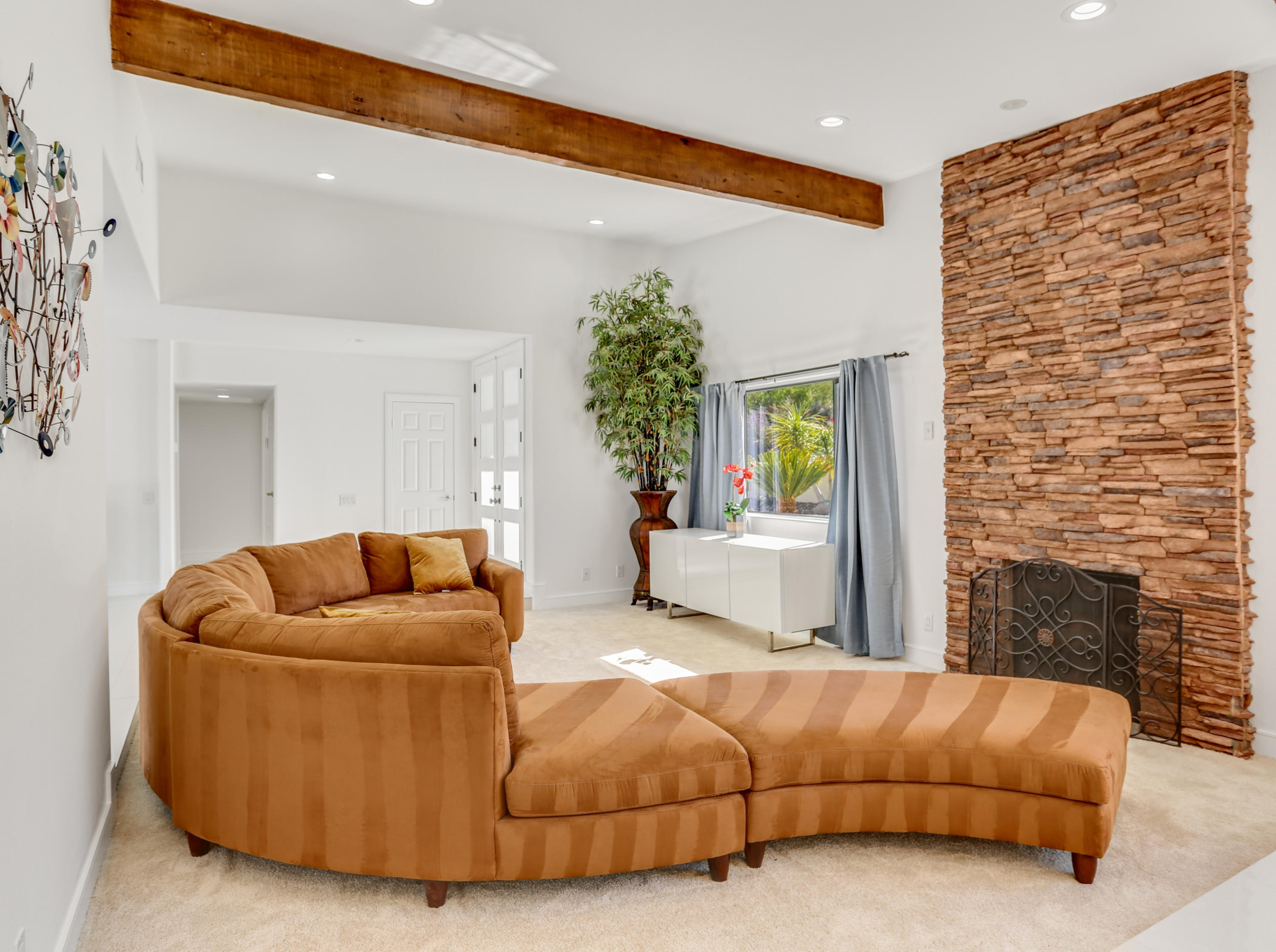 71480 Halgar Road Rancho Mirage, CA 92270 - Photo 9 of 52 a living room with furniture and a fireplace