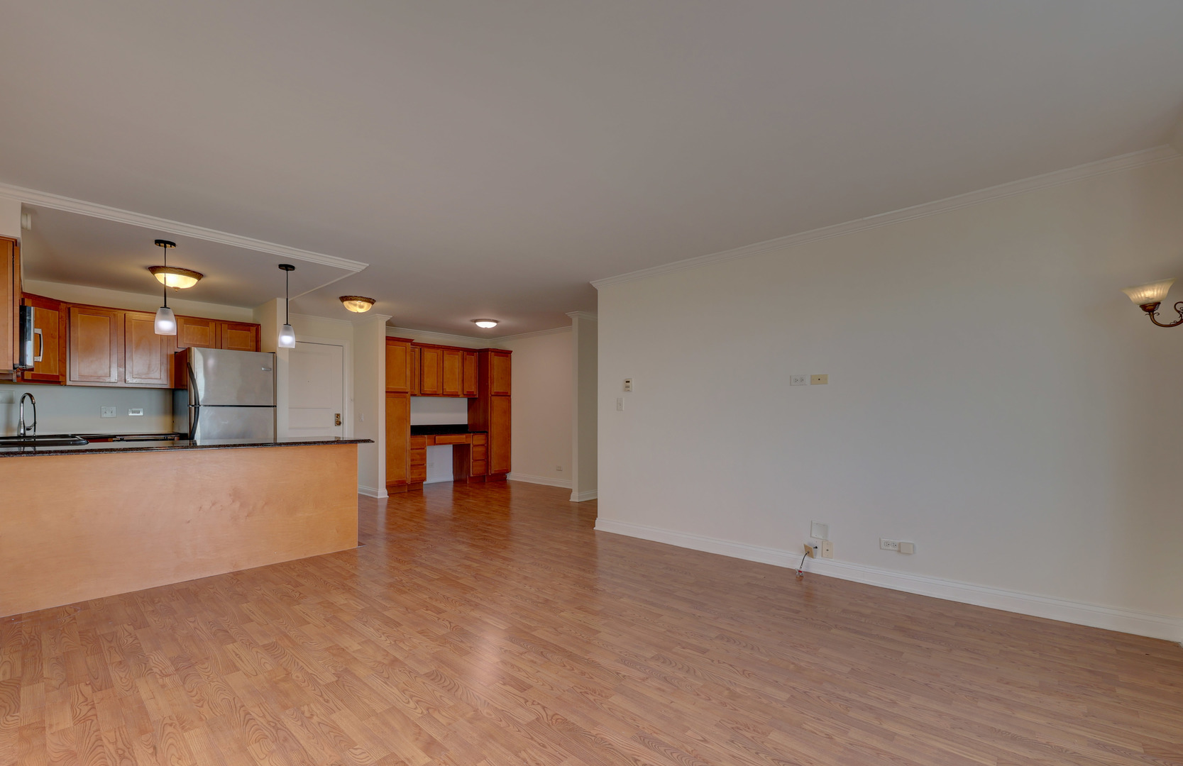 1 Renaissance Place, Unit 1212 Palatine, IL 60067 - Photo 13 of 28 a view of an empty room with a window and kitchen view