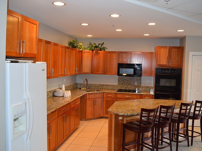 1 Renaissance Place, Unit 1212 Palatine, IL 60067 - Photo 23 of 28 a kitchen with granite countertop a sink and counter space