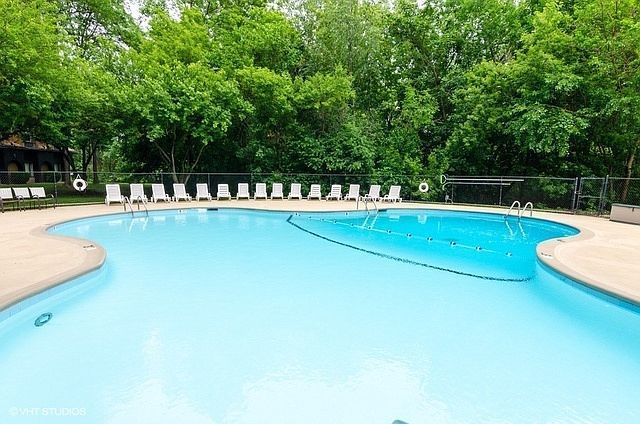 1 Renaissance Place, Unit 1212 Palatine, IL 60067 - Photo 25 of 28 a view of a swimming pool and trees in the background