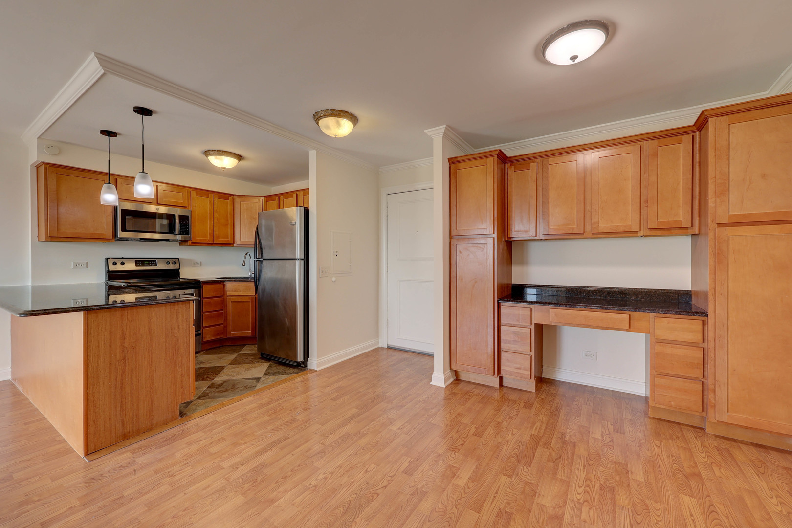 1 Renaissance Place, Unit 1212 Palatine, IL 60067 - Photo 8 of 28 a kitchen with stainless steel appliances a refrigerator and a stove top oven