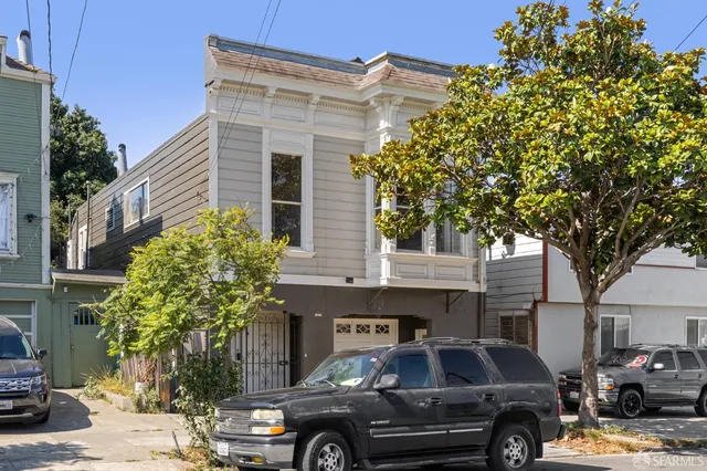 a view of cars parked in front of a building