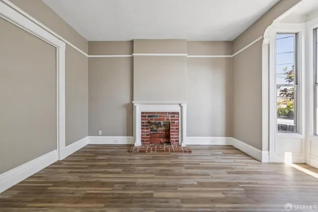 a view of front door with wooden floor