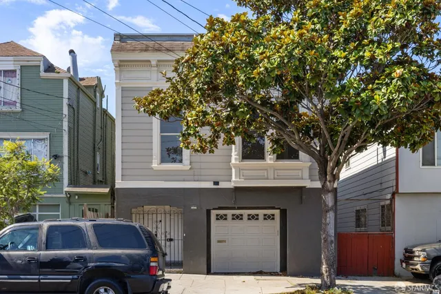 a front view of a building with parking space