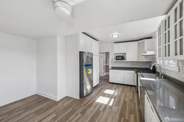 a kitchen with a sink and cabinets
