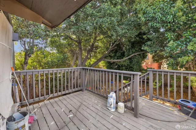 a living room filled with furniture and a window