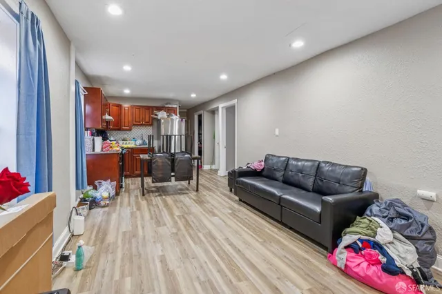 a bedroom with a bed and flat screen tv