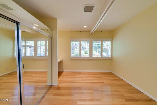 a bathroom with a sink a mirror and shower