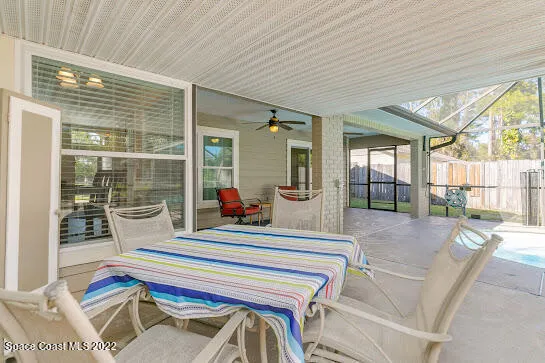 a living room with a couch and windows