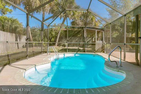 a view of a swimming pool with a patio