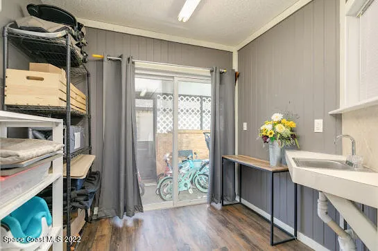 a kitchen with a refrigerator and a sink