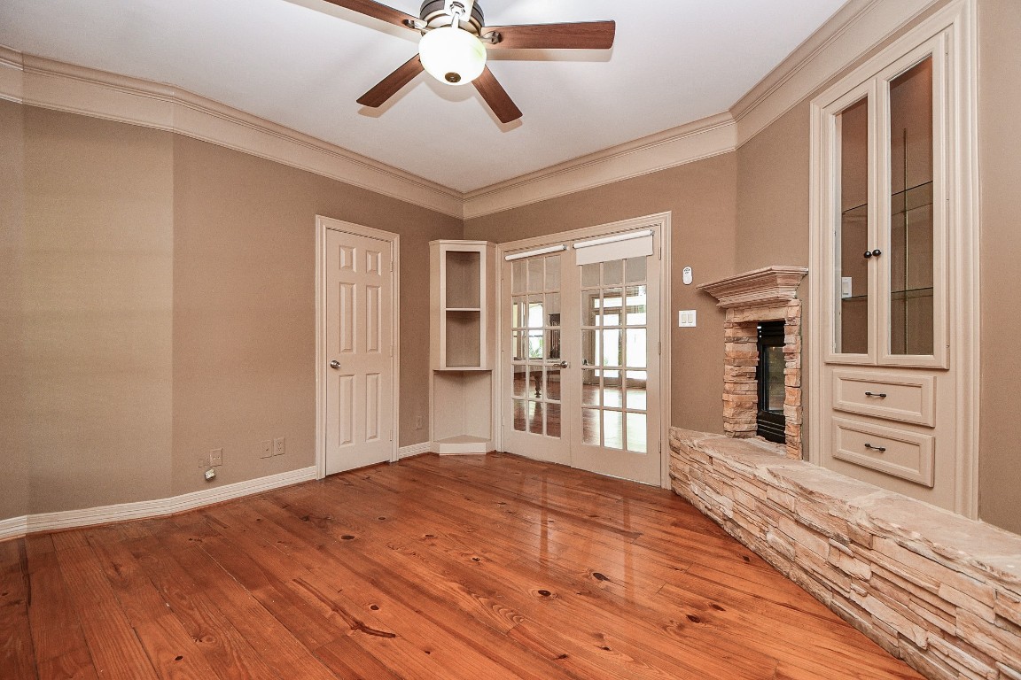 1240 Bingle Road Spring Valley Village, TX 77055 - Photo 11 of 49 a view of a livingroom with wooden floor and kitchen space