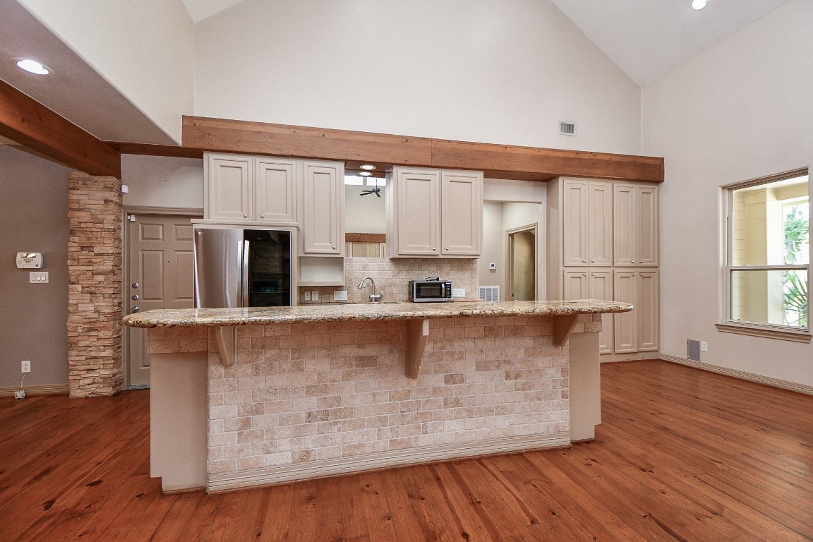 1240 Bingle Road Spring Valley Village, TX 77055 - Photo 13 of 49 Here is the very open kitchen with breakfast bar which is perfect for many people to sit and grab a bite in the morning or evening or as a buffet bar when entertaining. It also allows the cook to be included in the conversations and has wonderful appliances for any gourmet chef
