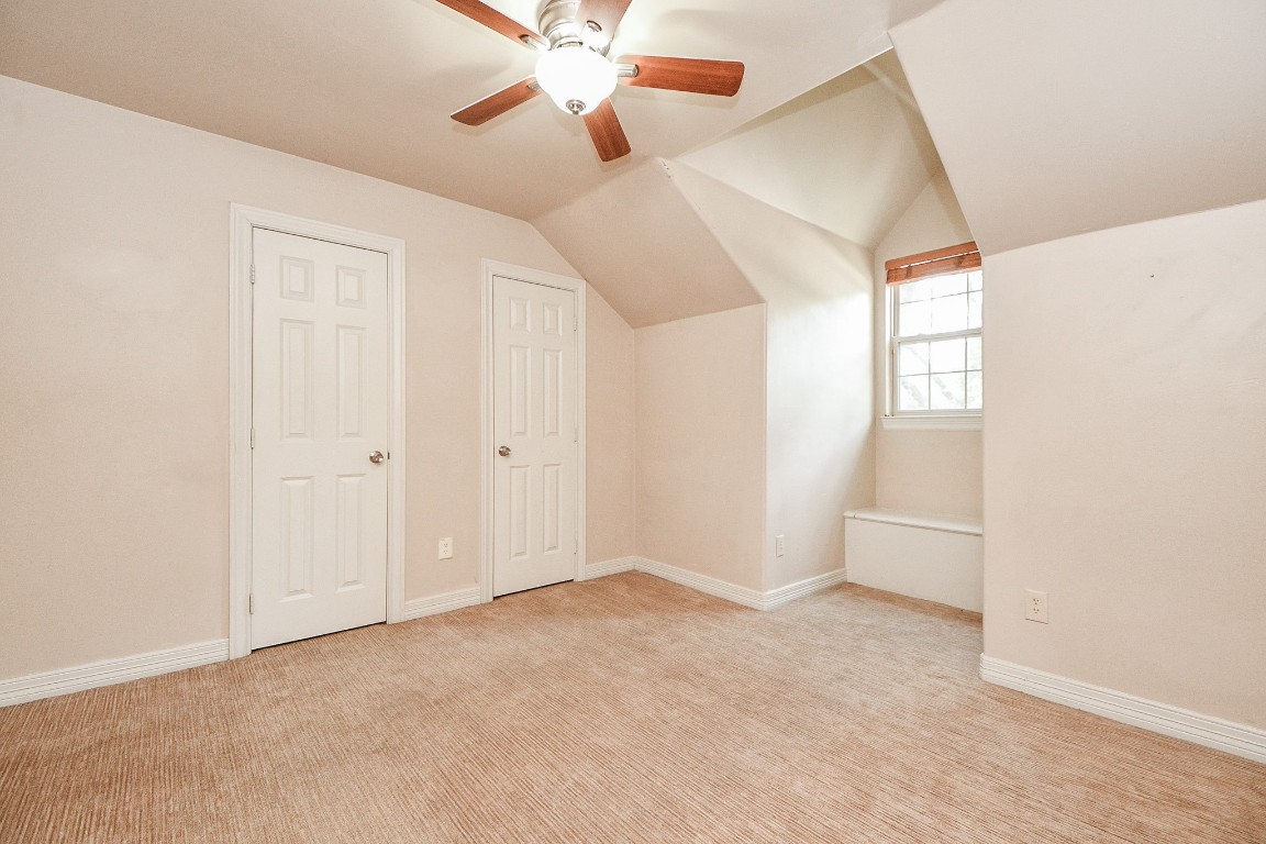 1240 Bingle Road Spring Valley Village, TX 77055 - Photo 29 of 49 This is a nice size bedroom at the top right of the stairs with a builtin window seat that is also designed for storage. The room also is carpeted and has a ceiling fan with lights.