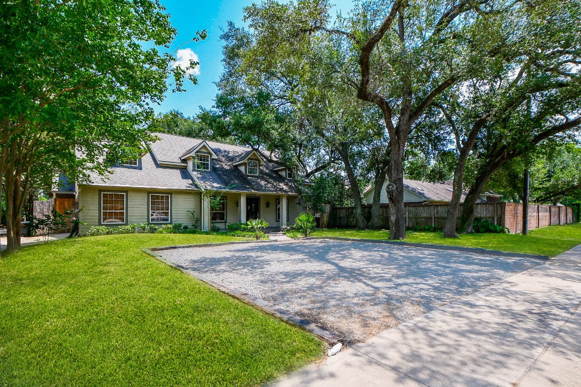 1240 Bingle Road Spring Valley Village, TX 77055 - Photo 3 of 49 a front view of a house with a yard and trees