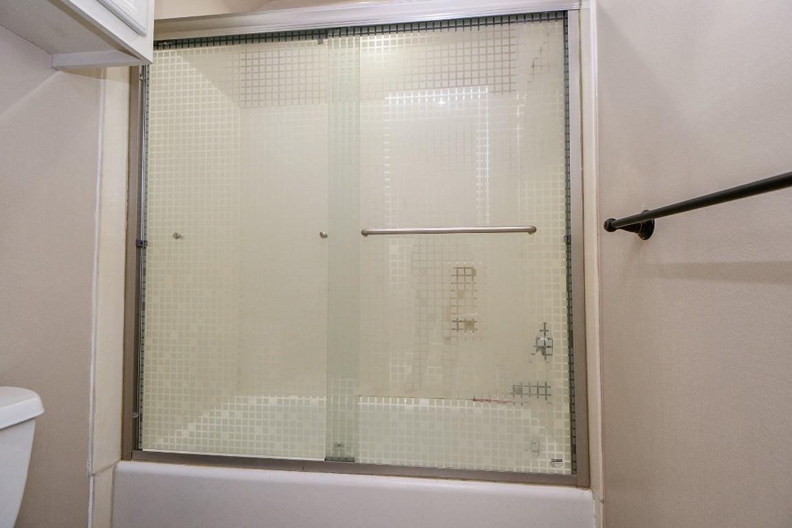 1240 Bingle Road Spring Valley Village, TX 77055 - Photo 34 of 49 The tub/shower combination has a built in sliding door