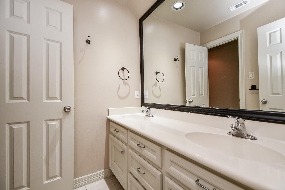 1240 Bingle Road Spring Valley Village, TX 77055 - Photo 35 of 49 a bathroom with a sink and a mirror
