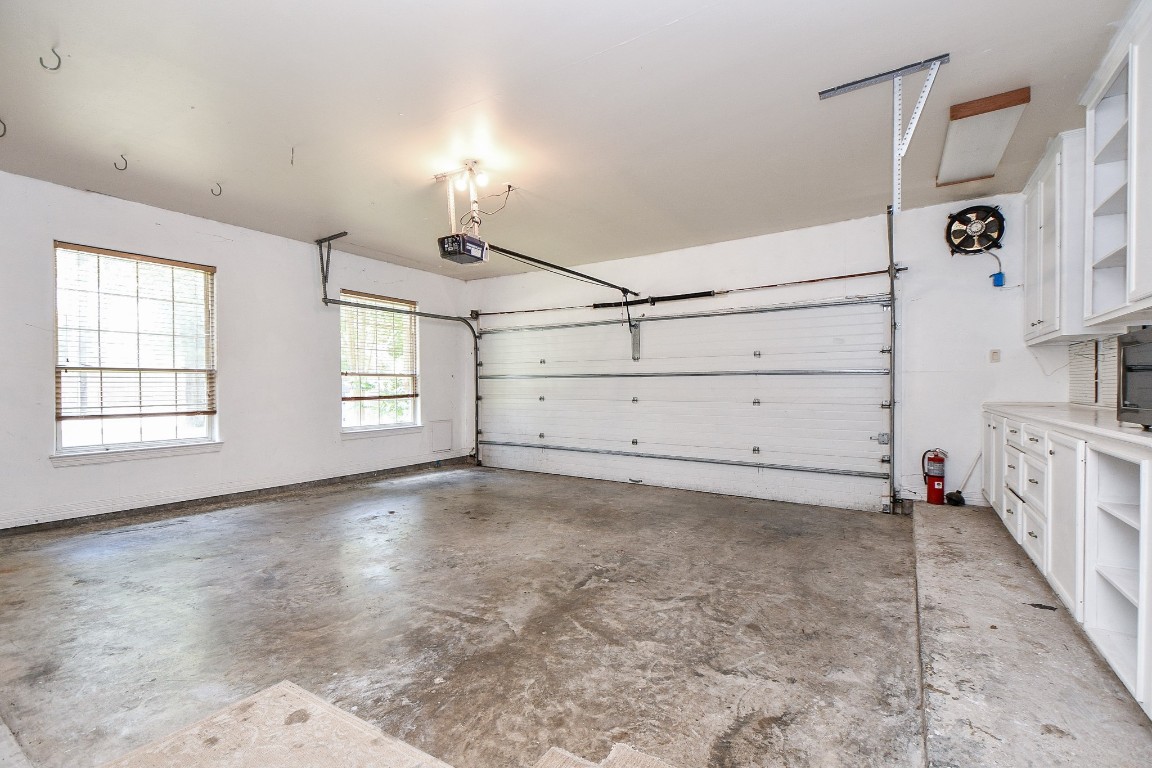 1240 Bingle Road Spring Valley Village, TX 77055 - Photo 49 of 49 Here is a view of the interior of the Very bright oversized garage with work benches and storage. Set up your appointment today to see this really unique and awesome home.