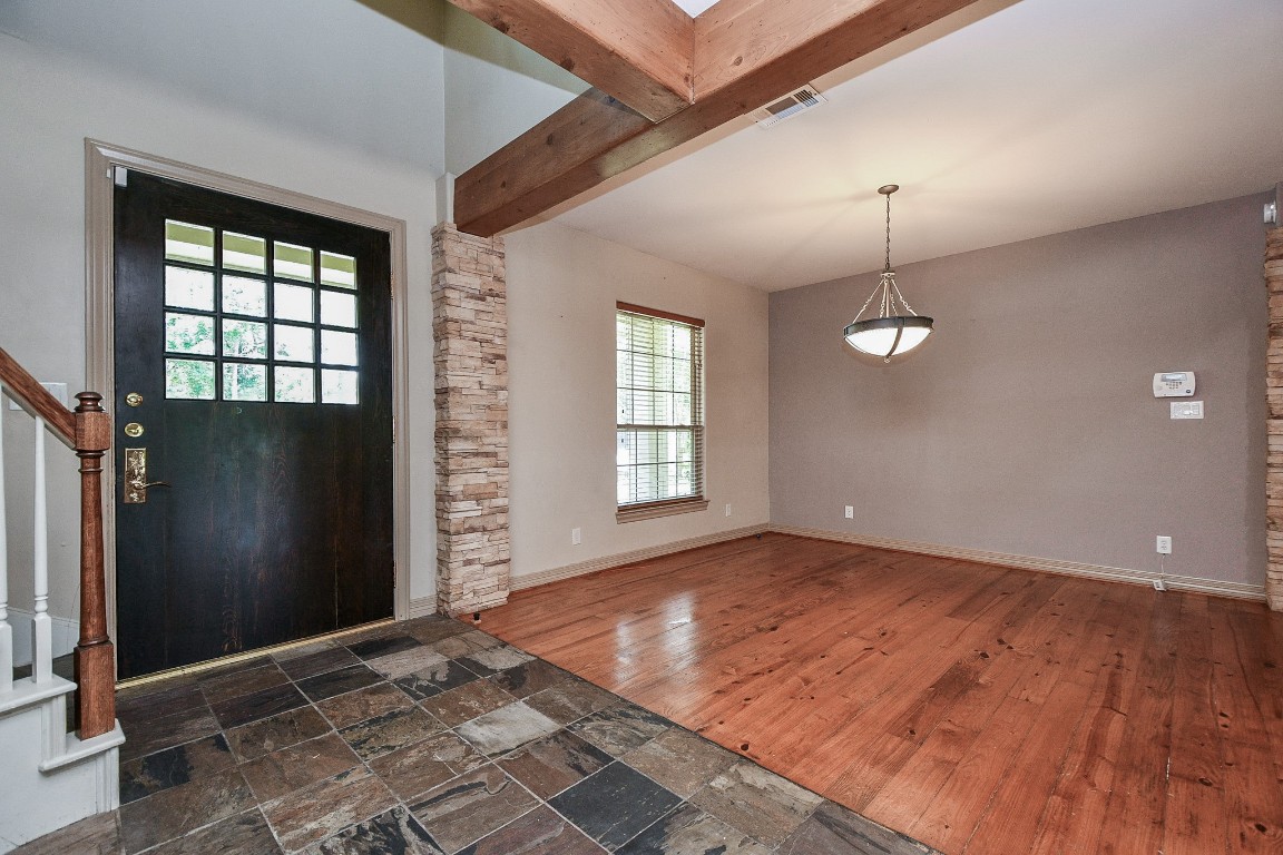 1240 Bingle Road Spring Valley Village, TX 77055 - Photo 5 of 49 a view of an empty room with a window and wooden floor