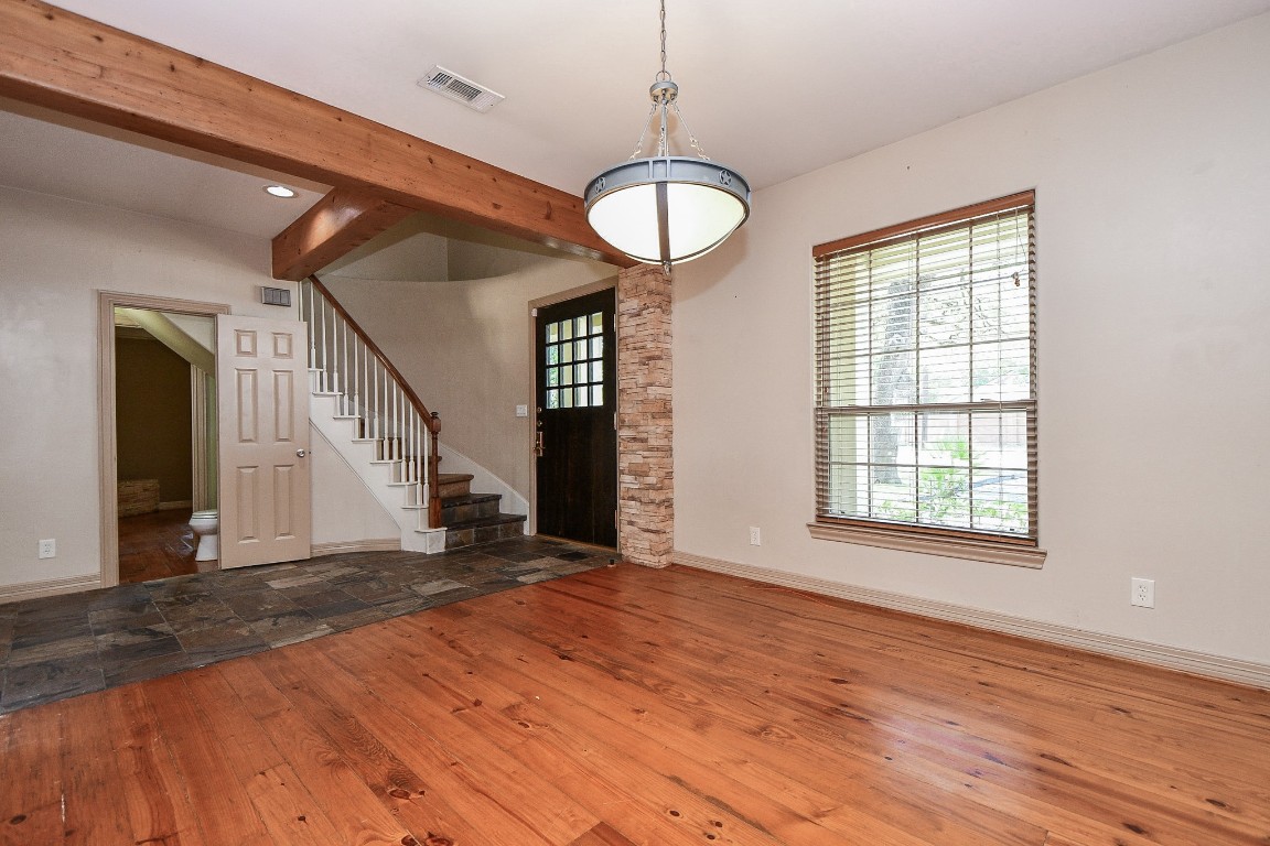 1240 Bingle Road Spring Valley Village, TX 77055 - Photo 6 of 49 an empty room with wooden floor fan and windows