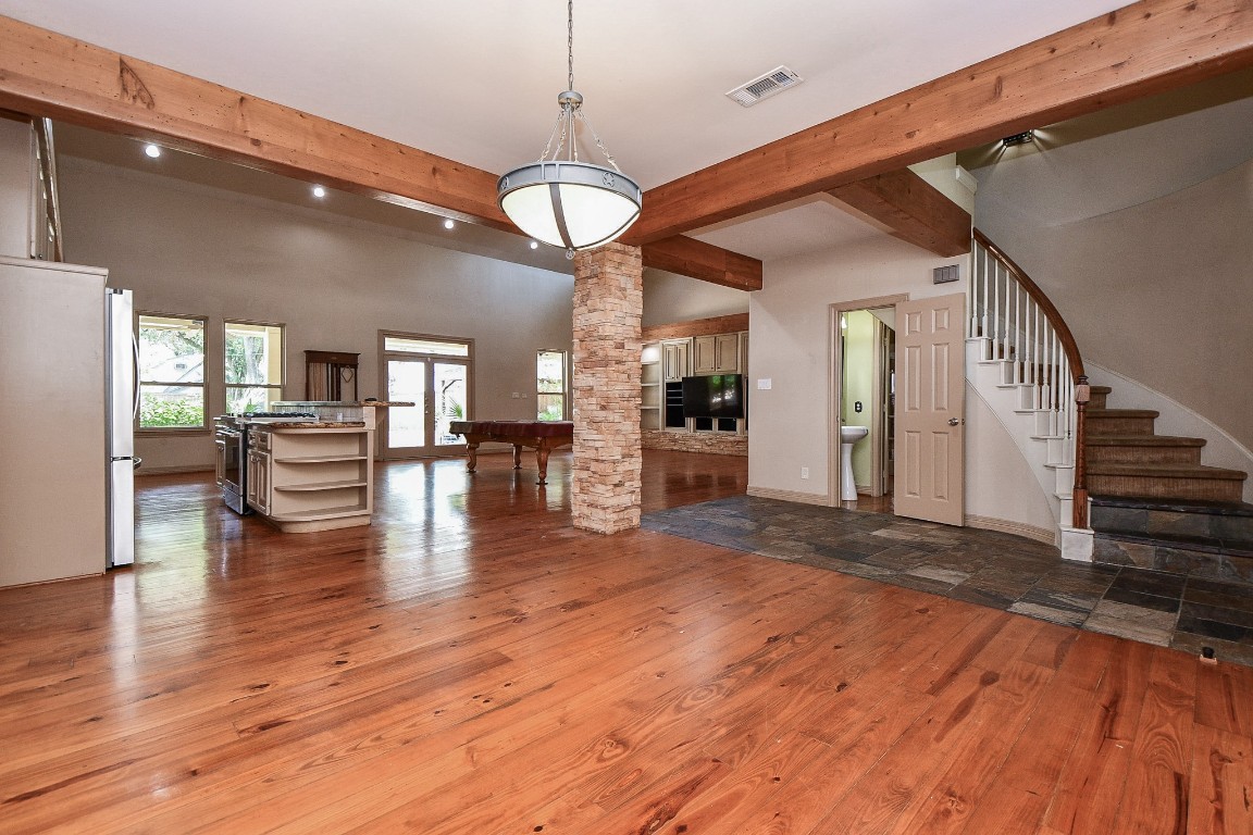 1240 Bingle Road Spring Valley Village, TX 77055 - Photo 8 of 49 a view of a room with wooden floor fireplace and windows