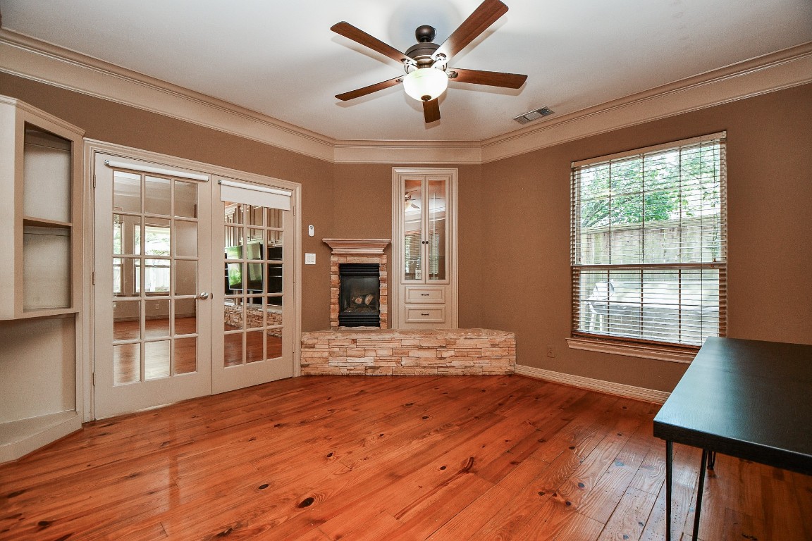 1240 Bingle Road Spring Valley Village, TX 77055 - Photo 10 of 49 a view of an empty room with window and wooden floor