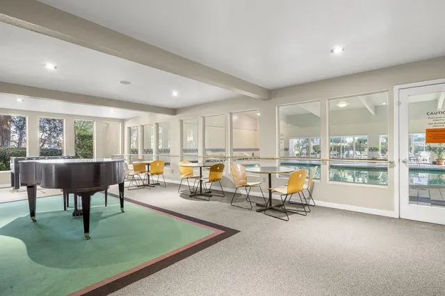a living room with lots of furniture and a table