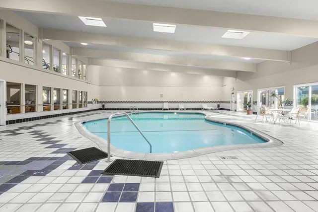 a view of a swimming pool and an outdoor space