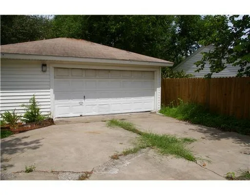 a aerial view of a house with a yard and garage