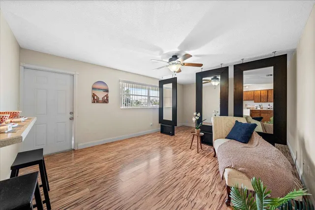 a bedroom with furniture and wooden floor