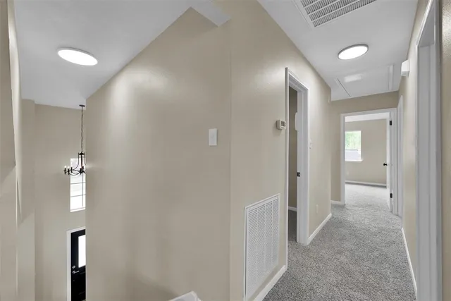 a view of a hallway with a white walls