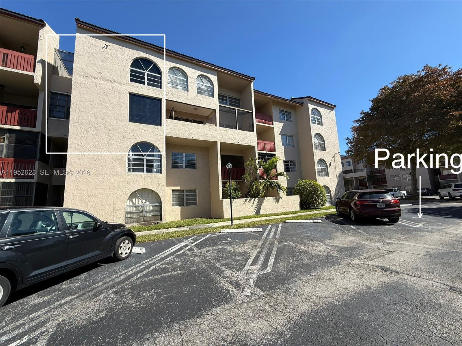 10641 Southwest 108th Avenue, Unit 3I Miami, FL 33176 - Photo 1 of 25 a car parked in front of a building